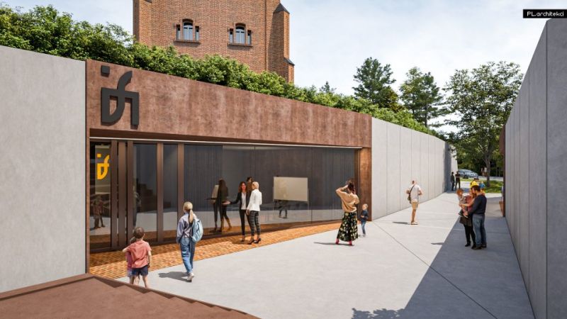 Wejście do wieży. Nad drzwiami widoczne logo muzeum.